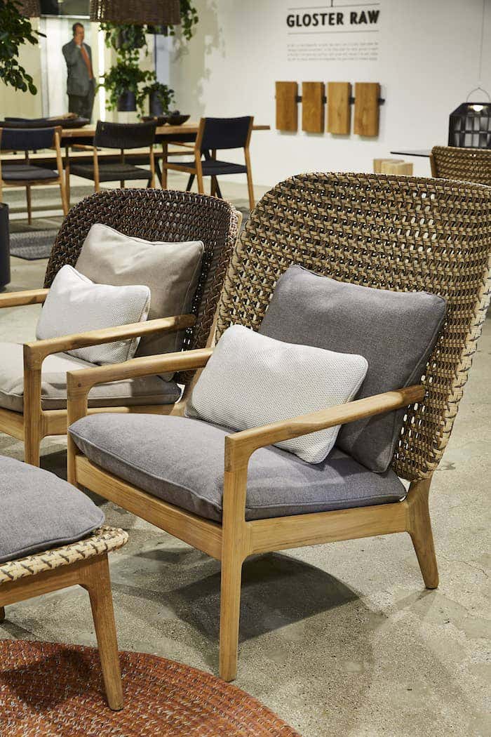 We also see natural materials with a modern touch in a Gloster high back wicker chair that provides a trend-setting polished look.