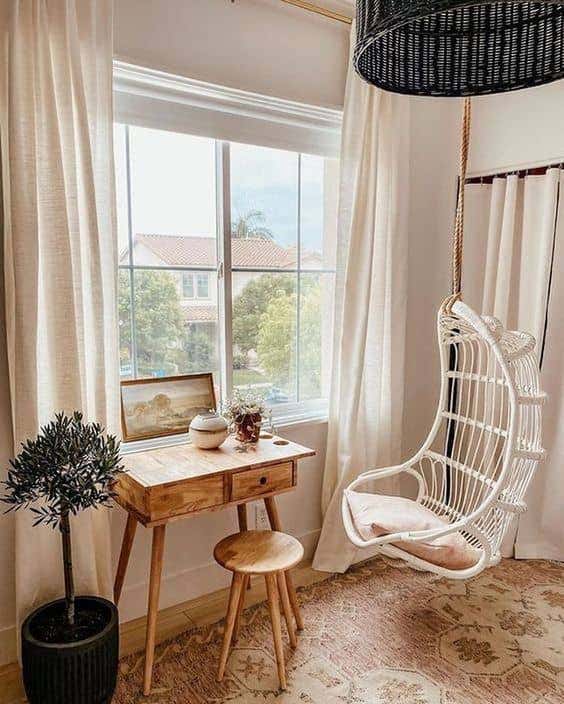 A stylish swinging chair and miniature desk turn your catch-all space into a comfy hangout that your kids will love.