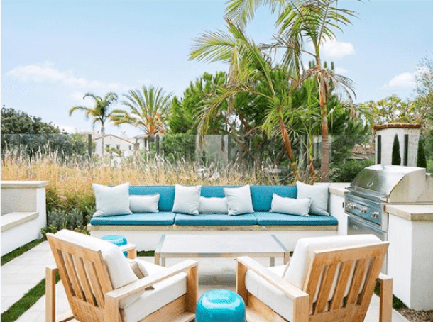 Contemporary basics meet Pacific coastal with this symmetrical outdoor living space, styled by Anne Michaelsen with Sunbrella performance fabrics in bright and coastal blues.