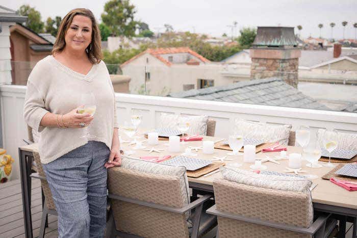 Anne Michaelsen at outdoor dining table