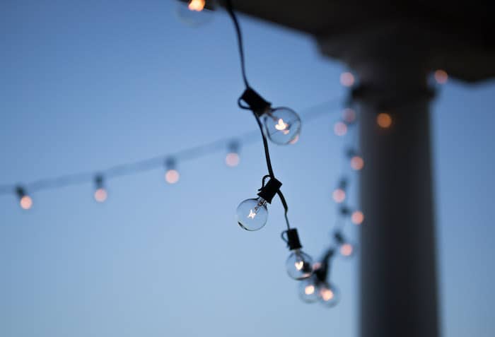 String lights or lanterns are a fun way to ensure you can enjoy your patio in the twilight hours.