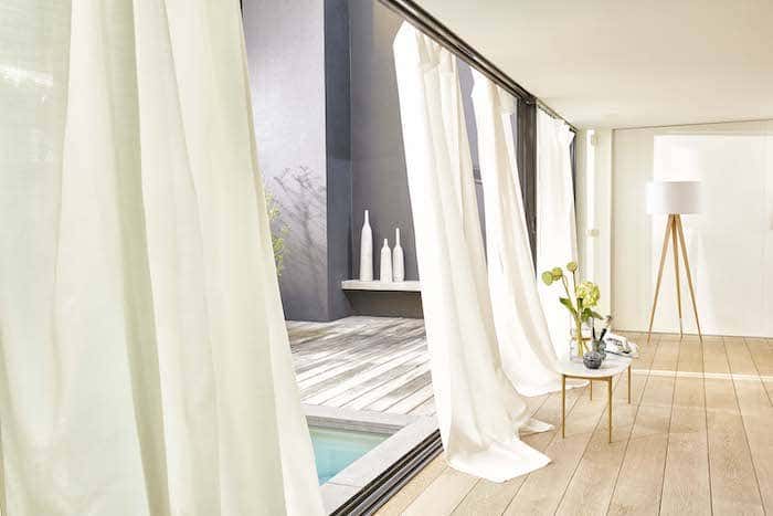 Certain curtain decor ideas likes this white floor to ceiling drapery can completely transform your space