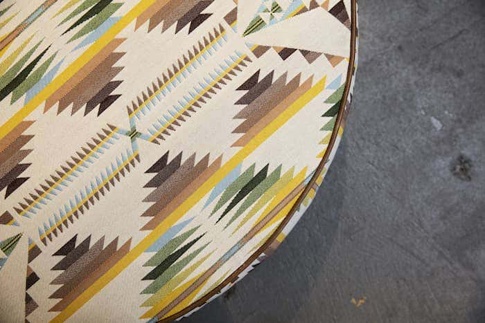 Ottoman upholstered in Americana geometric print with Sunbrella performance fabrics featured at High Point Market.