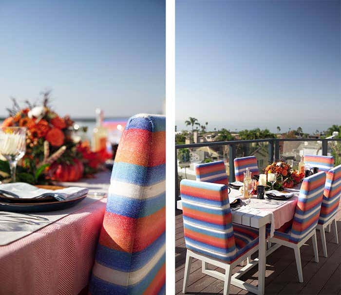 Outdoor dining seating, upholstered in Sunbrella performance fabrics adds a pop of color to the seasonal Thanksgiving tablescape