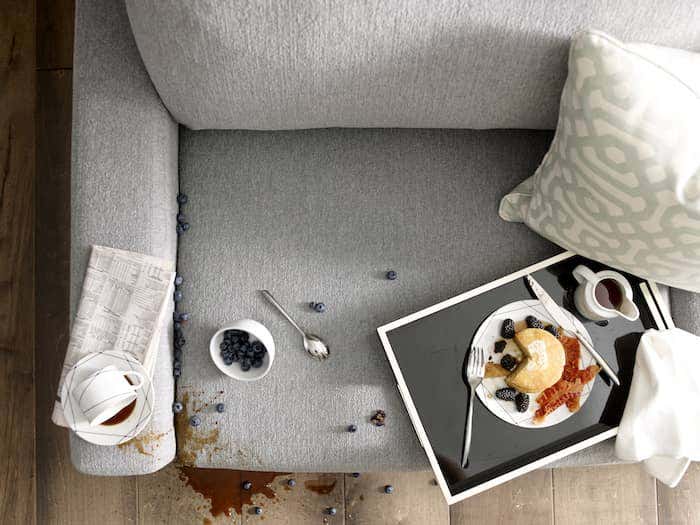 A breakfast spill is no match for this chair clad in gray Sunbrella fabric. To keep your Sunbrella fabric looking like new, follow these simple steps for the how to clean upholstery fabric.