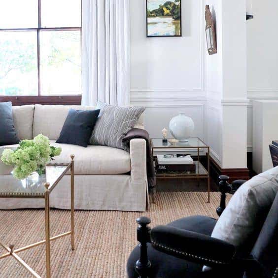 A neutral-colored, textured sofa creates a soothing foundation for your living space allowing you to layer in shades of blue hues. Steve Cordony curates a calming space using Sunbrella fabrics.