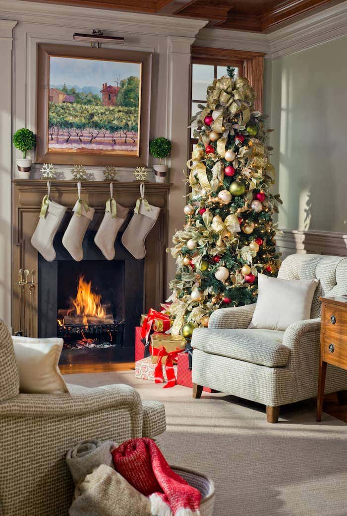 A cozy living room decorated for Christmas complete with Sunbrella fabrics to keep your family comfy all season long.