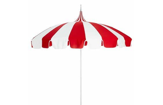 The Red and White Pagoda Patio Umbrella, available through One Kings Lane, is high on charm with its wide stripes.