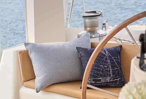 blue marine cushions and pillows with view of ocean from boat