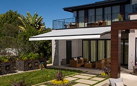 house awning white over with trees and fenced in porch