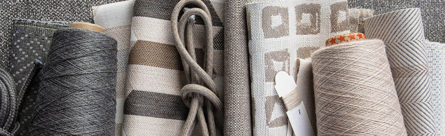 Gray tan and white upholstery fabrics ropes and thread