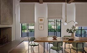 Dining area featuring Sunbrella roman window treatments