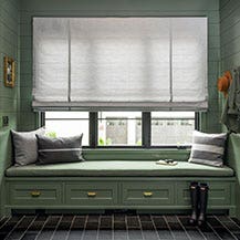 Mud room with roman shades