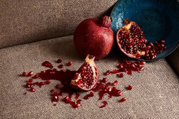 Pomegranate spilled on a sofa 