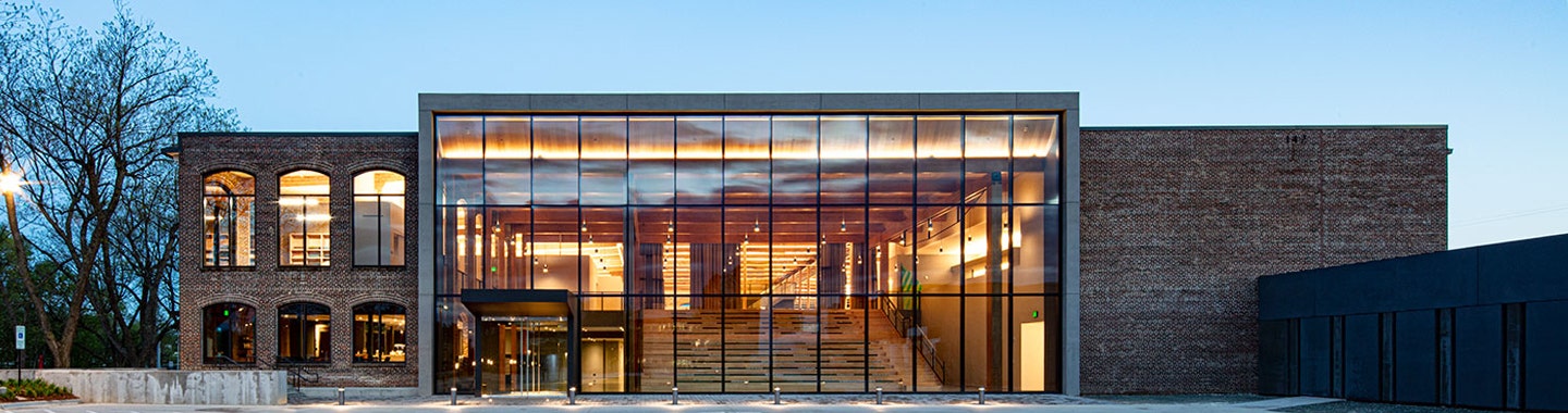 sunbrella headquarters brick building with glass facade