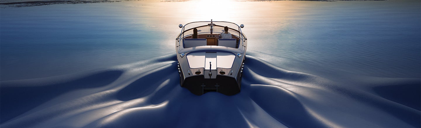 Couple in a boat floating toward the sunset