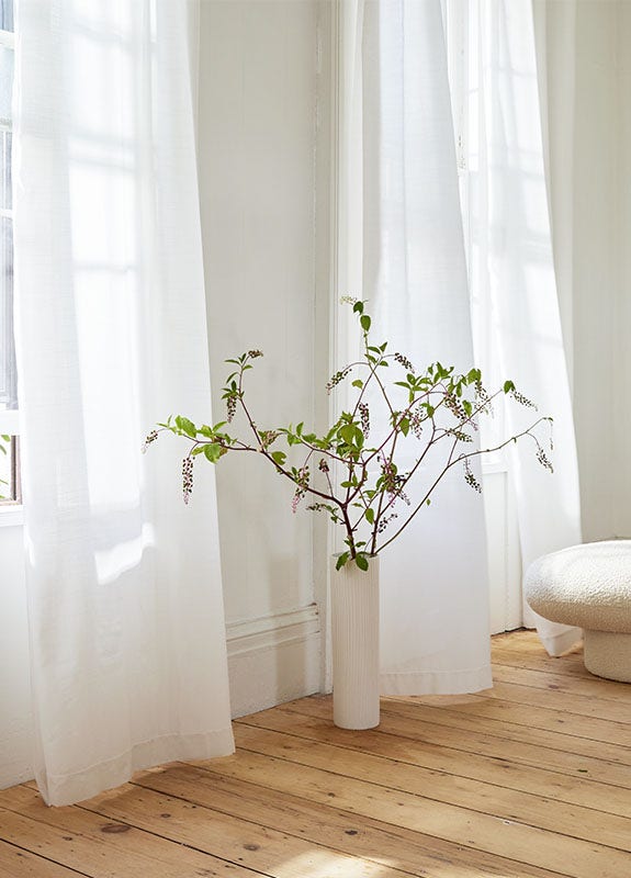 Bathroom with white Sunbrella sheer window treatments